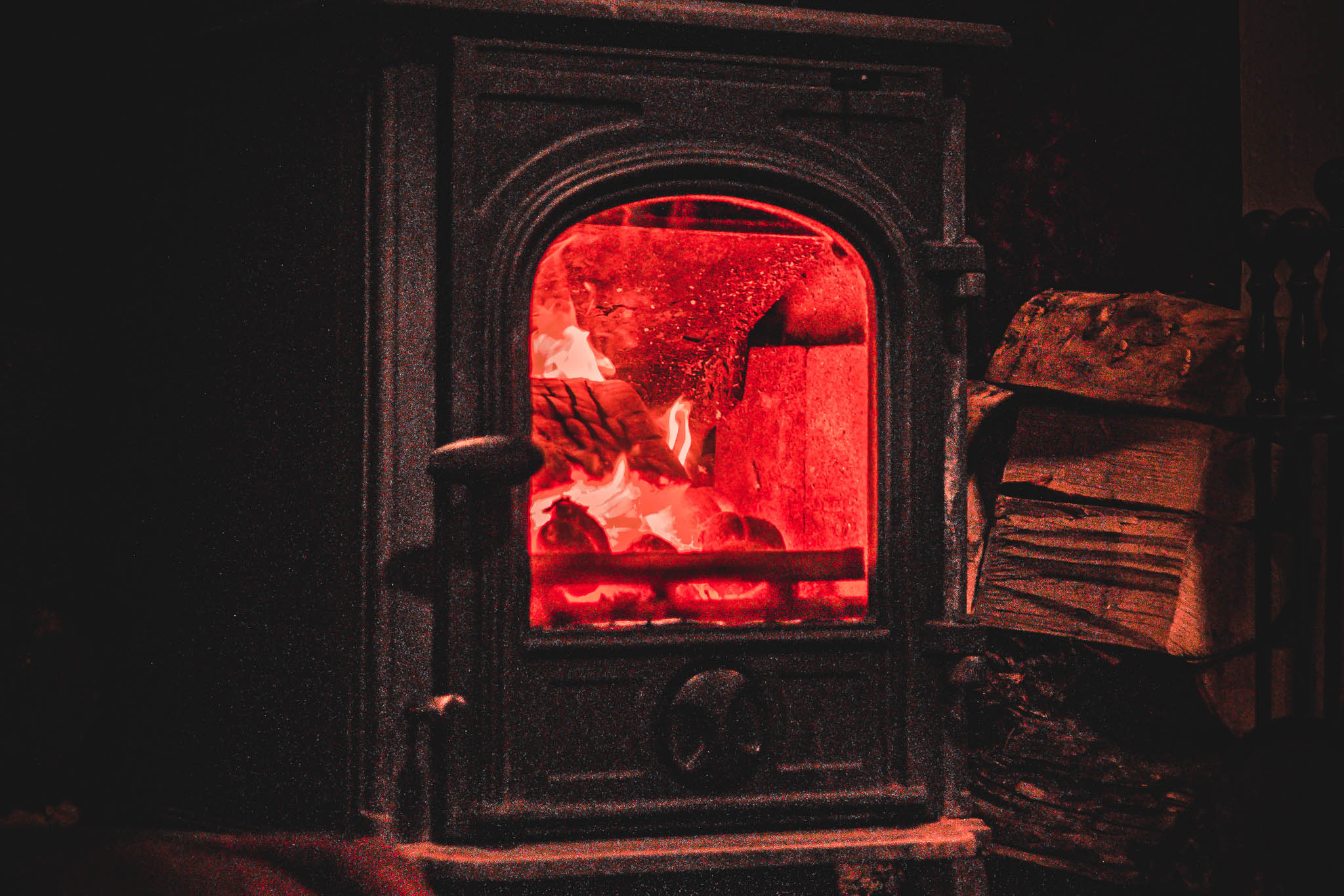 A roaring log burner warming the dining room